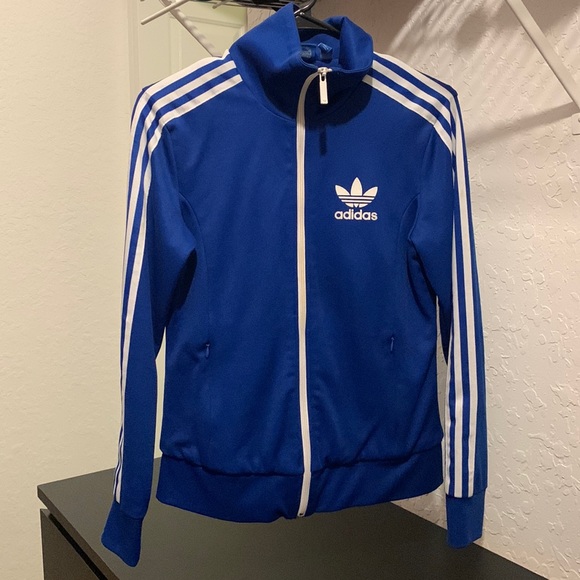 A blue Adidas jacket with butterfly design on the inside of the jacket. - Picture 1 of 2